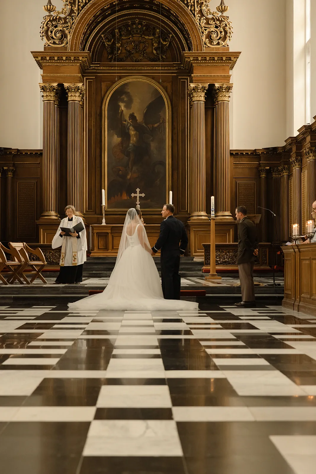 At the altar on the checkerboard floor &mdash; Elizabeth and Evan