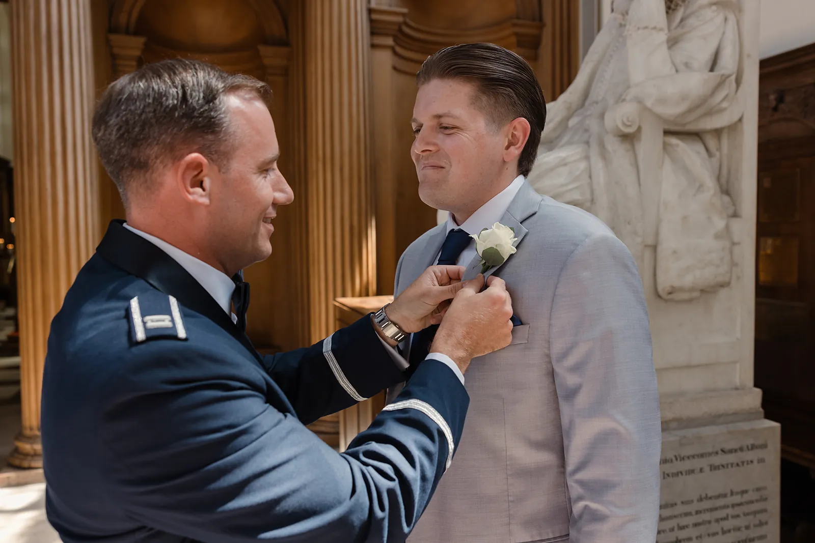Evan's buttonhole being pinned before the ceremony &mdash; Elizabeth and Evan